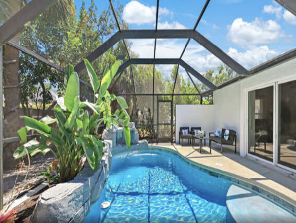 Three Bedroom Tropical Oasis in Naples with Caged Pool