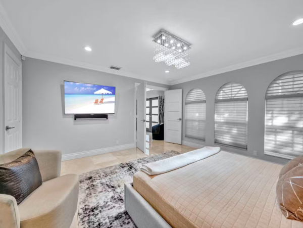 Stylish Waterfront Escape with Heated Pool, Games Room & Dock Access