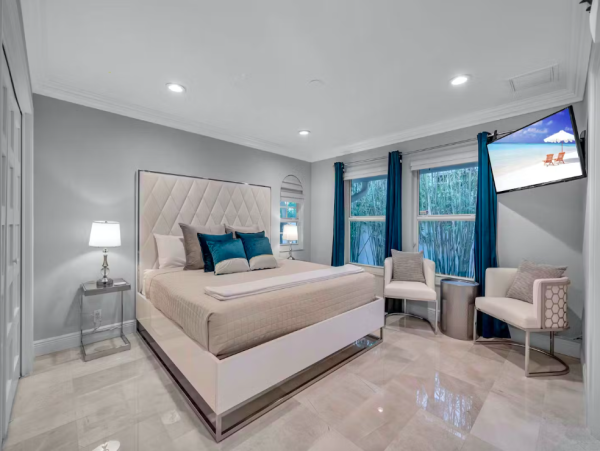 Stylish Waterfront Escape with Heated Pool, Games Room & Dock Access