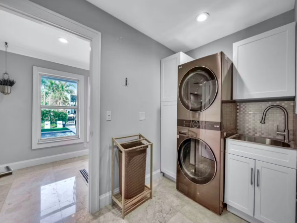 Stylish Waterfront Escape with Heated Pool, Games Room & Dock Access