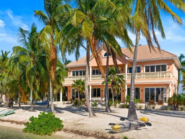 Cayman Kai Luxury Vacation Rental Beachfront Estate with Pool & Dock