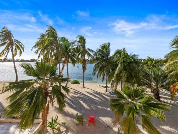 Cayman Kai Luxury Vacation Rental Beachfront Estate with Pool & Dock