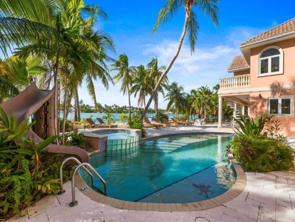 Cayman Kai Luxury Vacation Rental Beachfront Estate with Pool & Dock