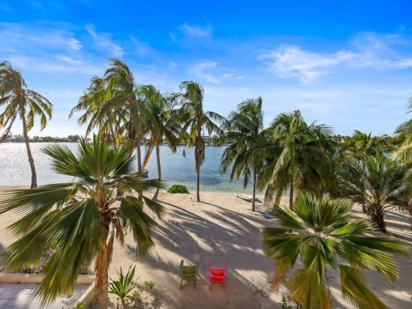 Cayman Kai Luxury Vacation Rental Beachfront Estate with Pool & Dock