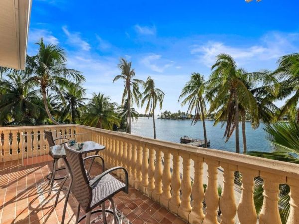 Cayman Kai Luxury Vacation Rental Beachfront Estate with Pool & Dock