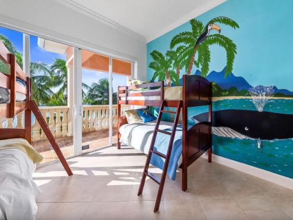 Cayman Kai Luxury Vacation Rental Beachfront Estate with Pool & Dock