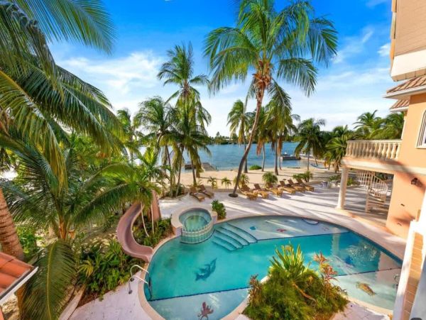 Cayman Kai Luxury Vacation Rental Beachfront Estate with Pool & Dock