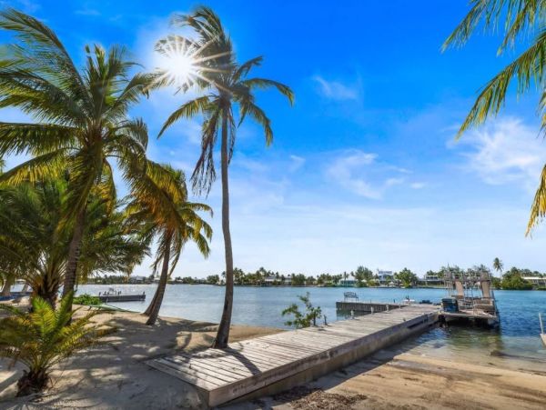 Cayman Kai Luxury Vacation Rental Beachfront Estate with Pool & Dock