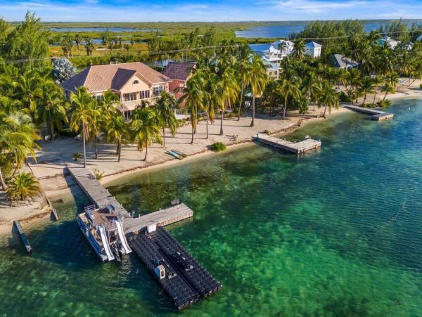 Cayman Kai Luxury Vacation Rental Beachfront Estate with Pool & Dock