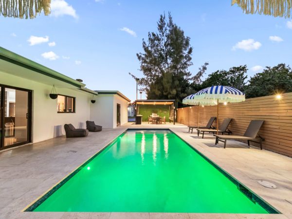 Miami Vacation Rental 6-Bedroom Villa with Tennis Court, Pool & Canal Access