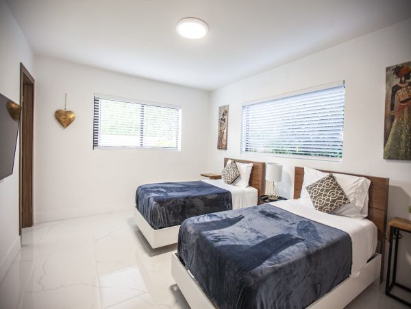Miami Vacation Rental 6-Bedroom Villa with Tennis Court, Pool & Canal Access