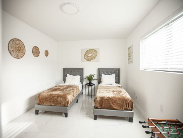Miami Vacation Rental 6-Bedroom Villa with Tennis Court, Pool & Canal Access