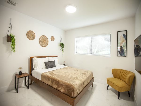 Miami Vacation Rental 6-Bedroom Villa with Tennis Court, Pool & Canal Access