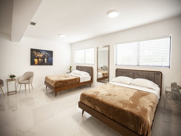 Miami Vacation Rental 6-Bedroom Villa with Tennis Court, Pool & Canal Access