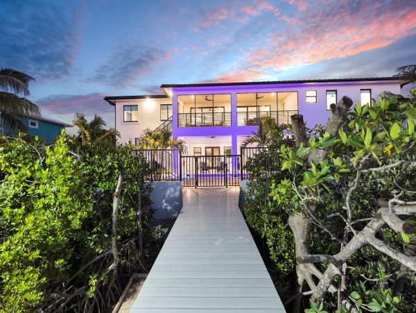 Luxurious Waterfront Retreat in Coco Plum - 5-Bedroom, Private Pool & Dock