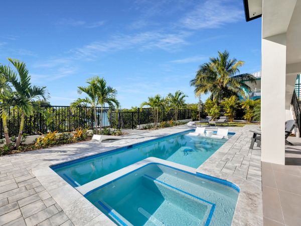 Luxurious Waterfront Retreat in Coco Plum - 5-Bedroom, Private Pool & Dock