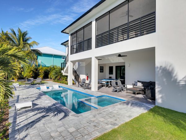 Luxurious Waterfront Retreat in Coco Plum - 5-Bedroom, Private Pool & Dock
