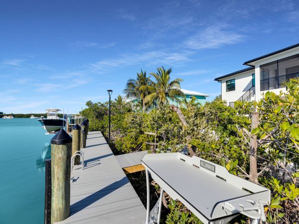 Luxurious Waterfront Retreat in Coco Plum - 5-Bedroom, Private Pool & Dock