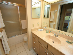 bathroom with tub and shower