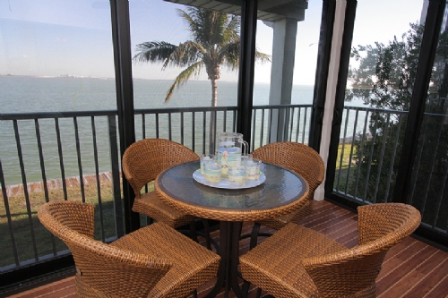 Screened balcony with outdoor furniture