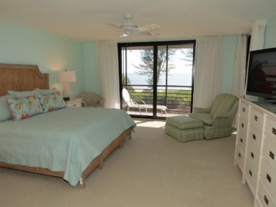 Master bedroom with TV & private balcony