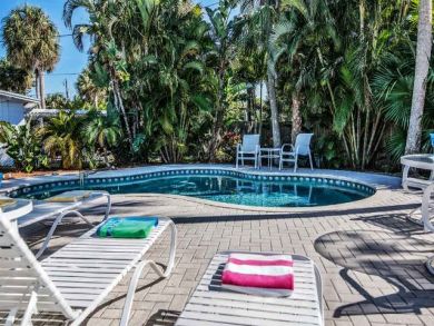Sun Loungers and Chairs Around Pool