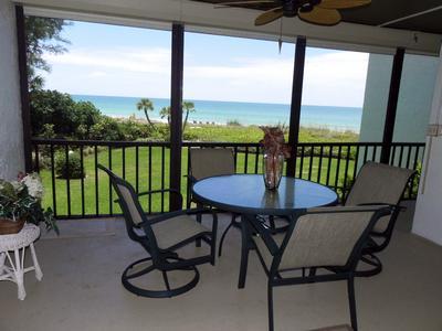 Beach view balcony with table set Beach view balcony with table set