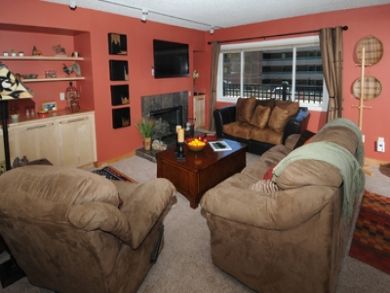 Living room with fireplace & flat screen TV