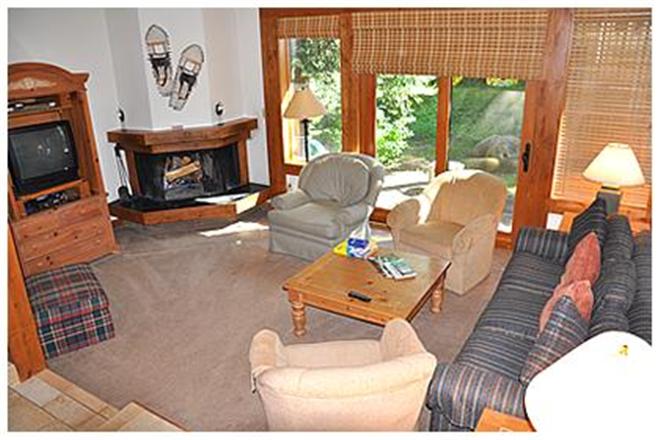 Living room with fireplace & TV