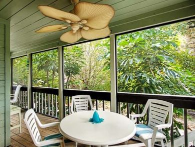Screened balcony with table set