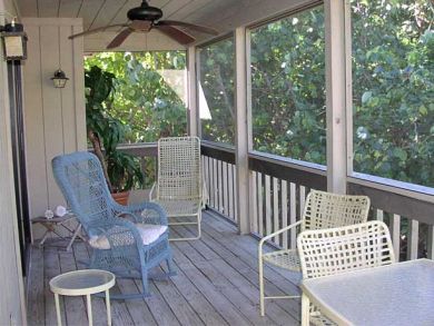 Screened balcony with outdoor furniture Screened balcony with outdoor furniture