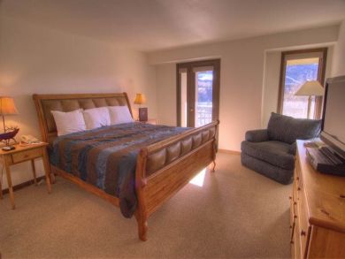 Master bedroom with king bed Master bedroom with king bed