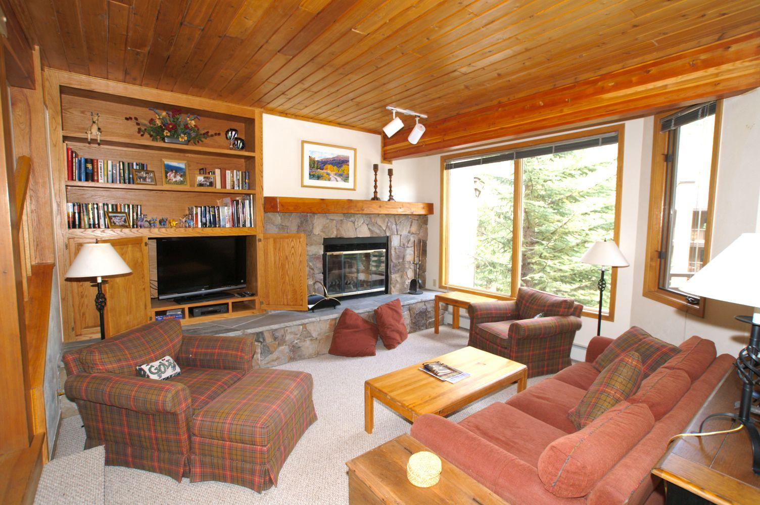 Living room with flat screen TV & fireplace