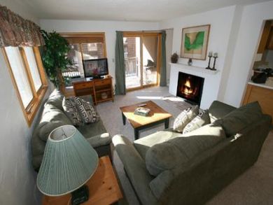Living room with fireplace & flat screen TV
