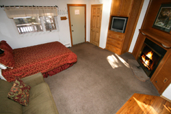 Sleeping area with queen bed & twin sleeper sofa Sleeping area with queen bed & twin sleeper sofa
