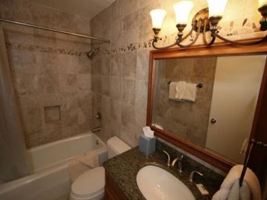 Bathroom with tub and shower
