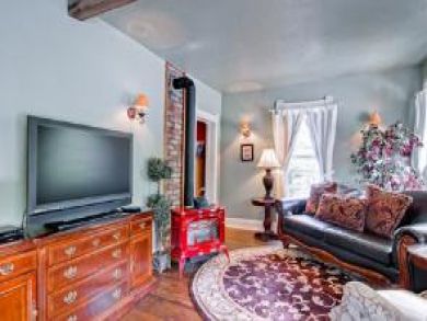 One of three living areas with gas fireplace & flat screen TV