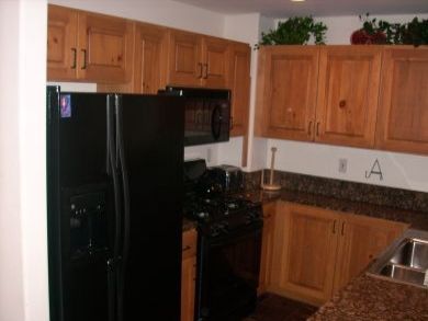 Full kitchen with granite counter tops Full kitchen with granite counter tops
