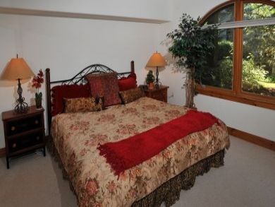 Master bedroom with king bed Master bedroom with king bed