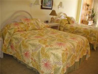 Master bedroom with two queen beds