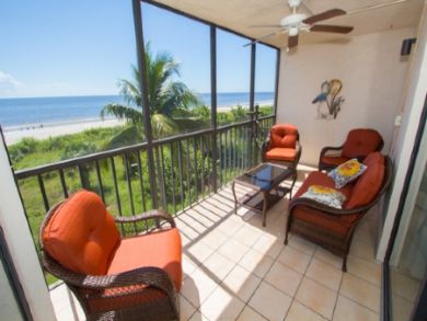 Screened balcony with nice comfortable outdoor seating