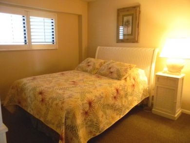 Queen bed in guest bedroom