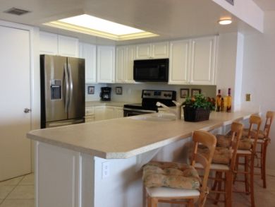 Kitchen with breakfast bar seats four