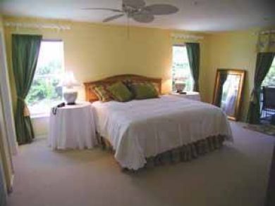 Master bedroom with king bed Master bedroom with king bed