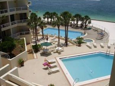 Shared pools & hot tub right on the beach