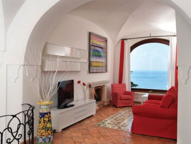 Ground floor living room with fireplace & plasma TV