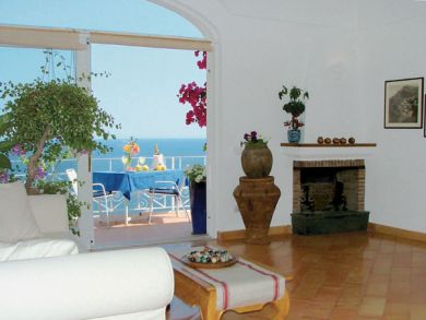 Living room with fireplace & open to terrace
