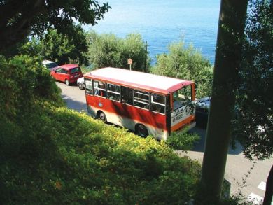 Bus stop across the street from foot path entrance