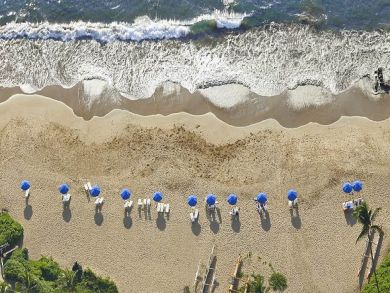 Sandy beach with lounge chairs