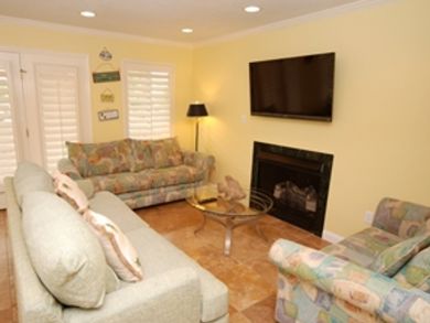 Living room with flat screen TV & fireplace